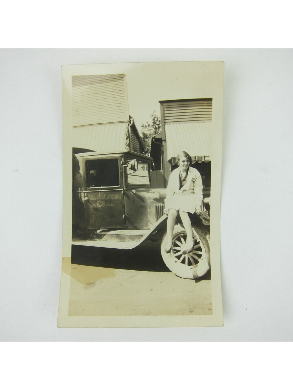 Vintage 1930s Photograph Young Woman Sits on Truck Ansonia Lighting Co Ohio